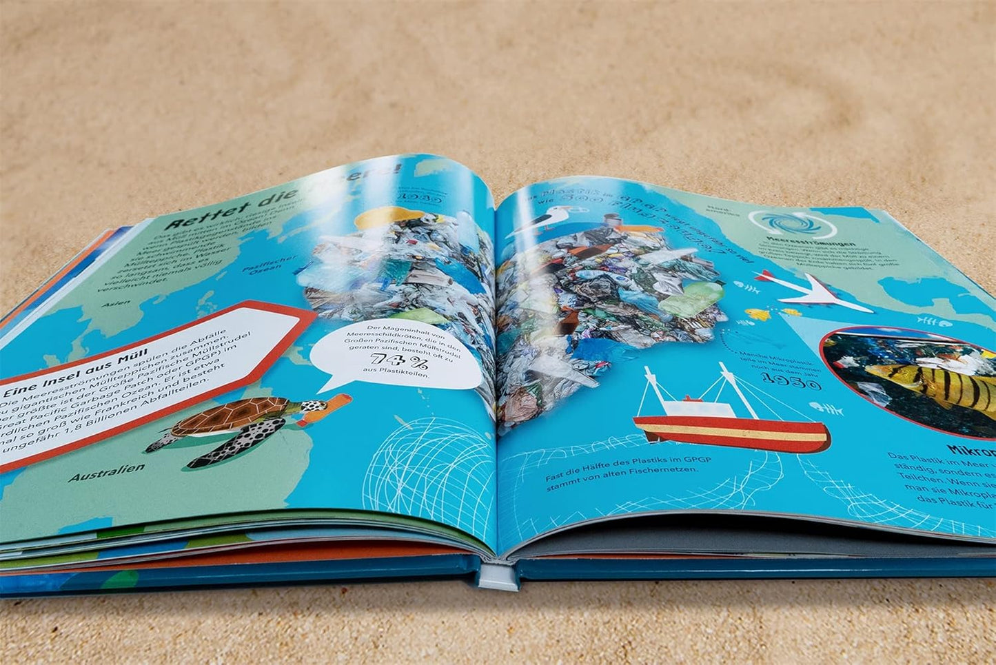 Open book with colorful illustrations on a beige surface
