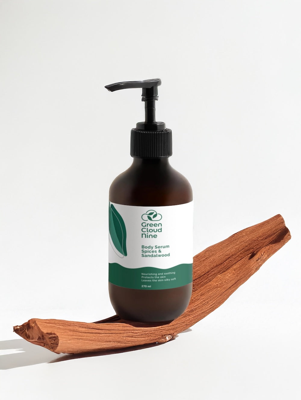 Body serum spices & sandalwood in brown pump bottle with white label, displayed on sandalwood