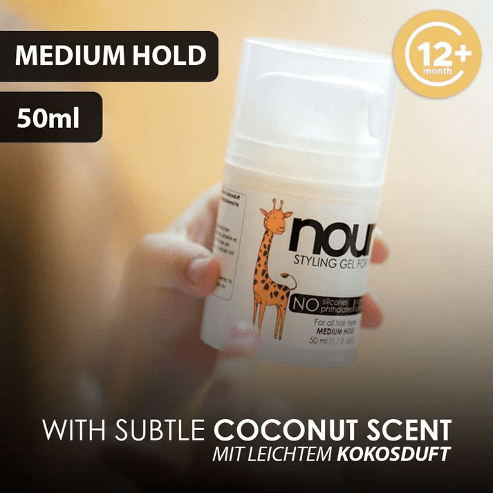 A children hand holding a Bottle of hair gel by noni