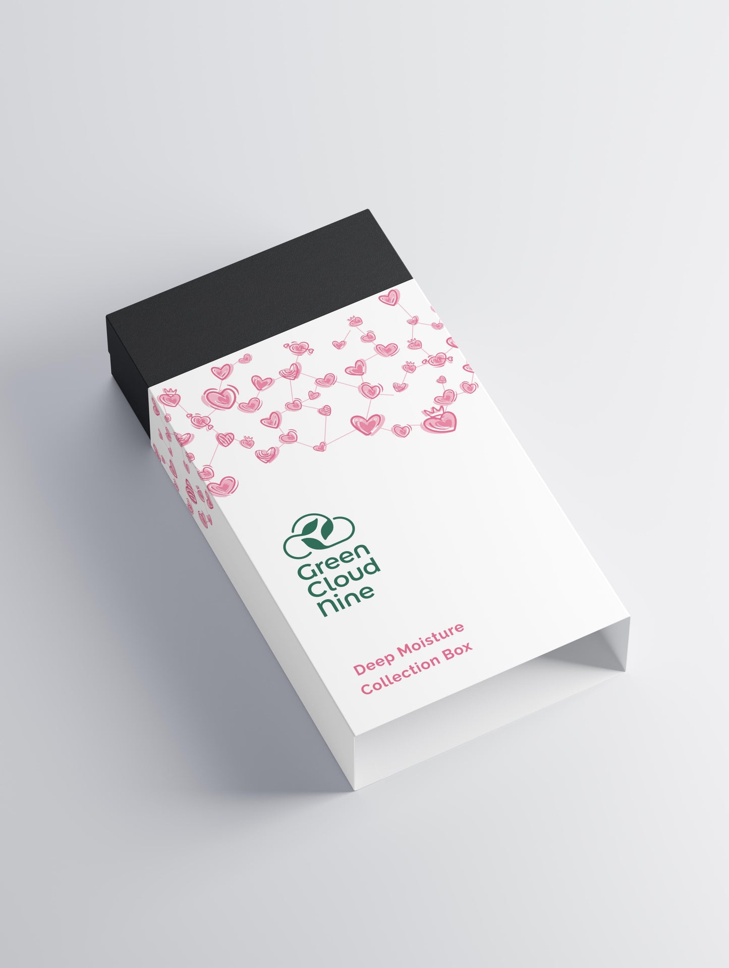 White product packaging with pink heart pattern and 'Green Cloud Nine' branding on a gray background