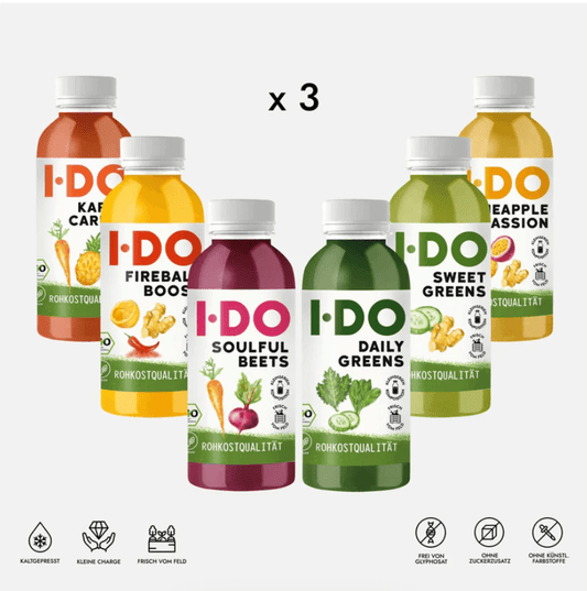 Set of six colorful I DO organic juice bottles, part of a 3-day cold-pressed vegan juice cleanse for energy and wellness.