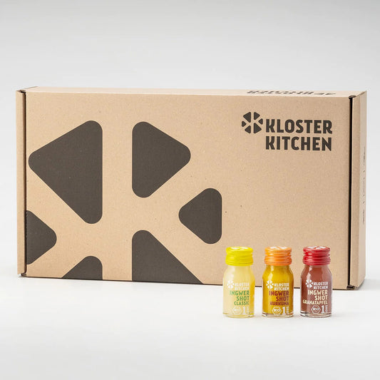Kloster Kitchen 6-week ginger shot set with 3 mini bottles and a kraft box labeled with logo, featuring 6 flavors.