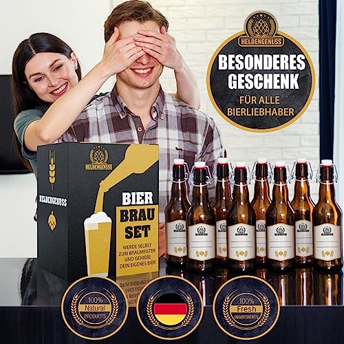 Couple with beer brewing gift set, smiling man surprised by woman, 8 filled bottles in front, labeled as natural and fresh.