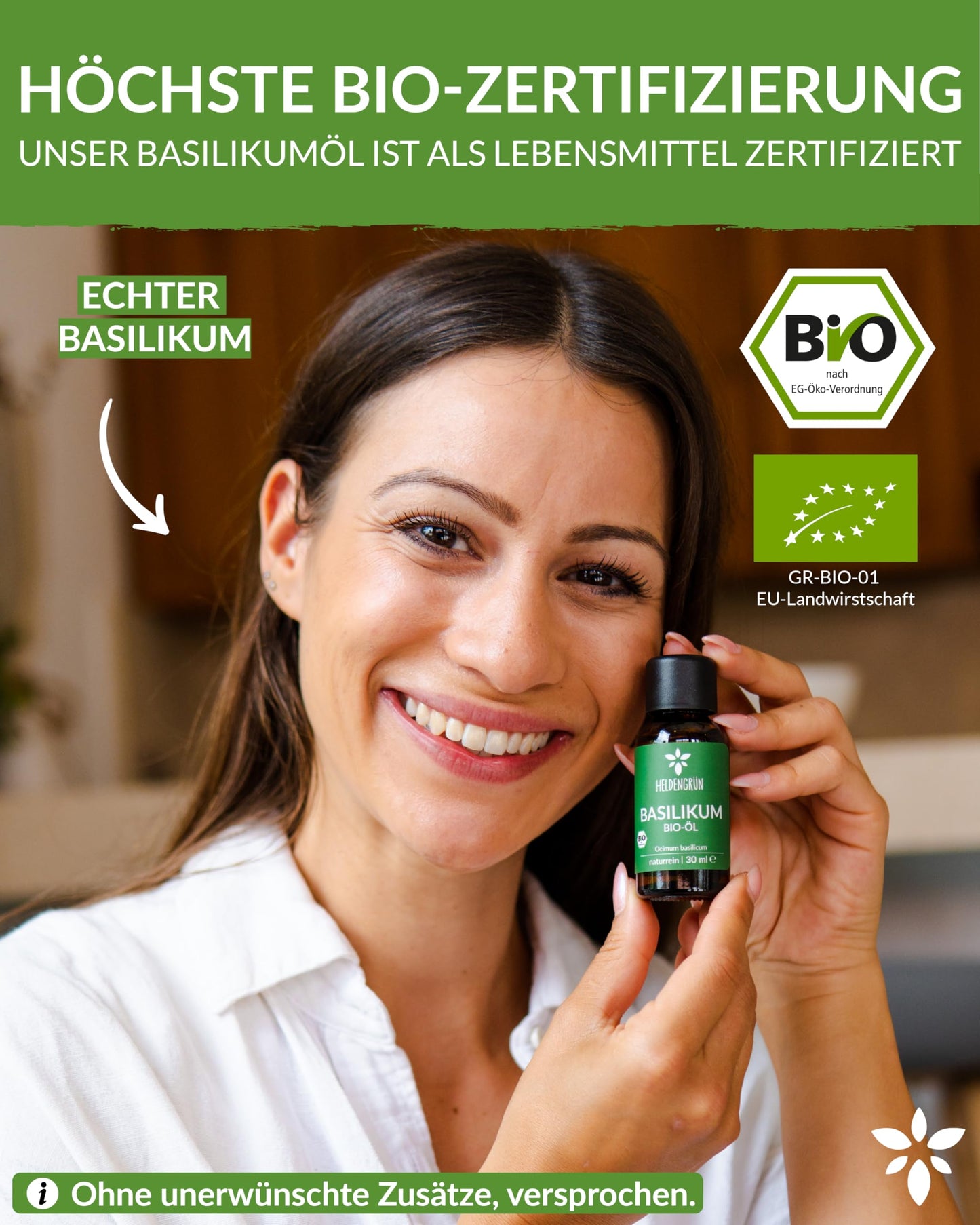A woman holding a bottle of Heldengrun Organic Essential Oil 30ml basilikum