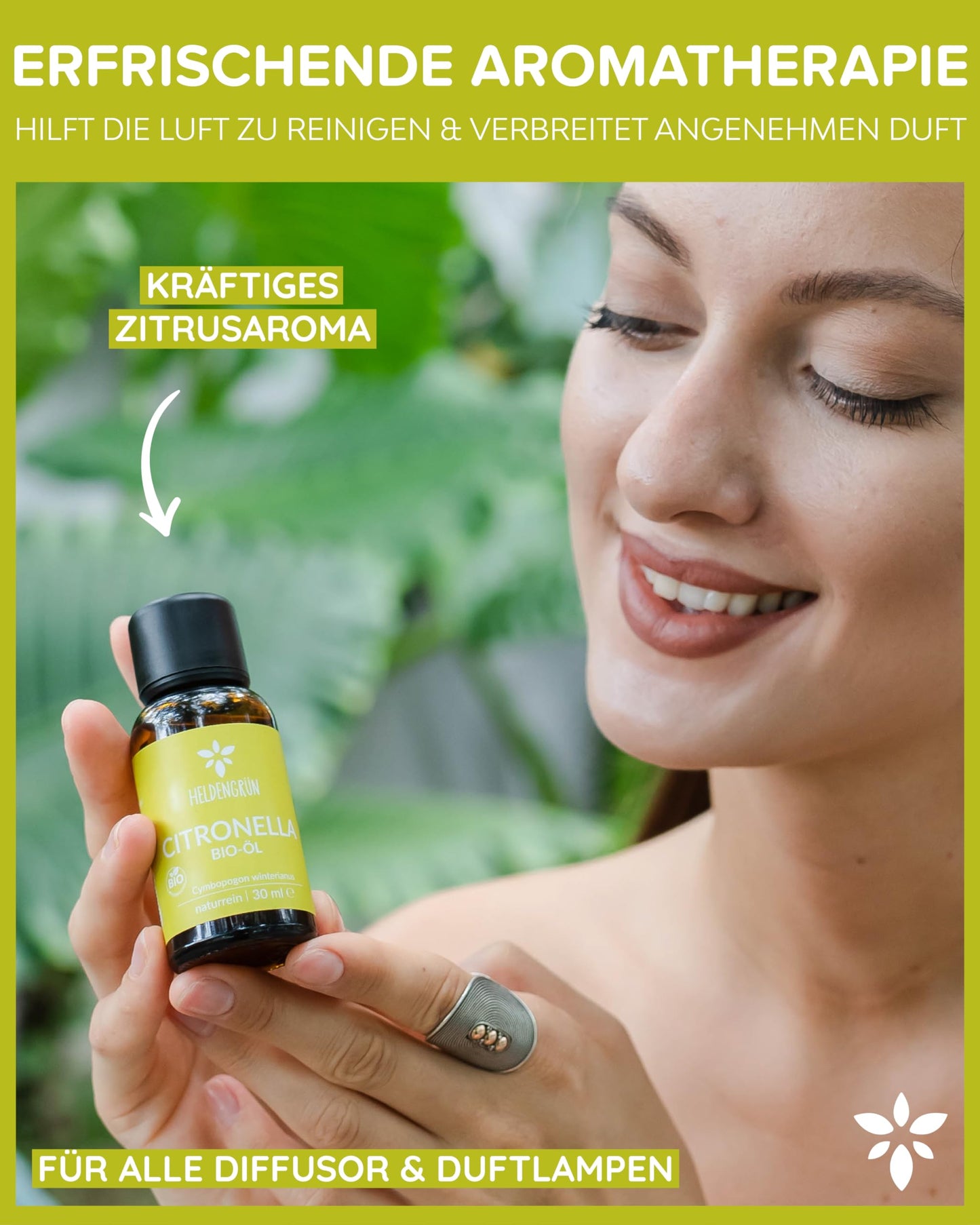 A woman holding a bottle of Heldengrun Organic Essential Oil 30ml citronella