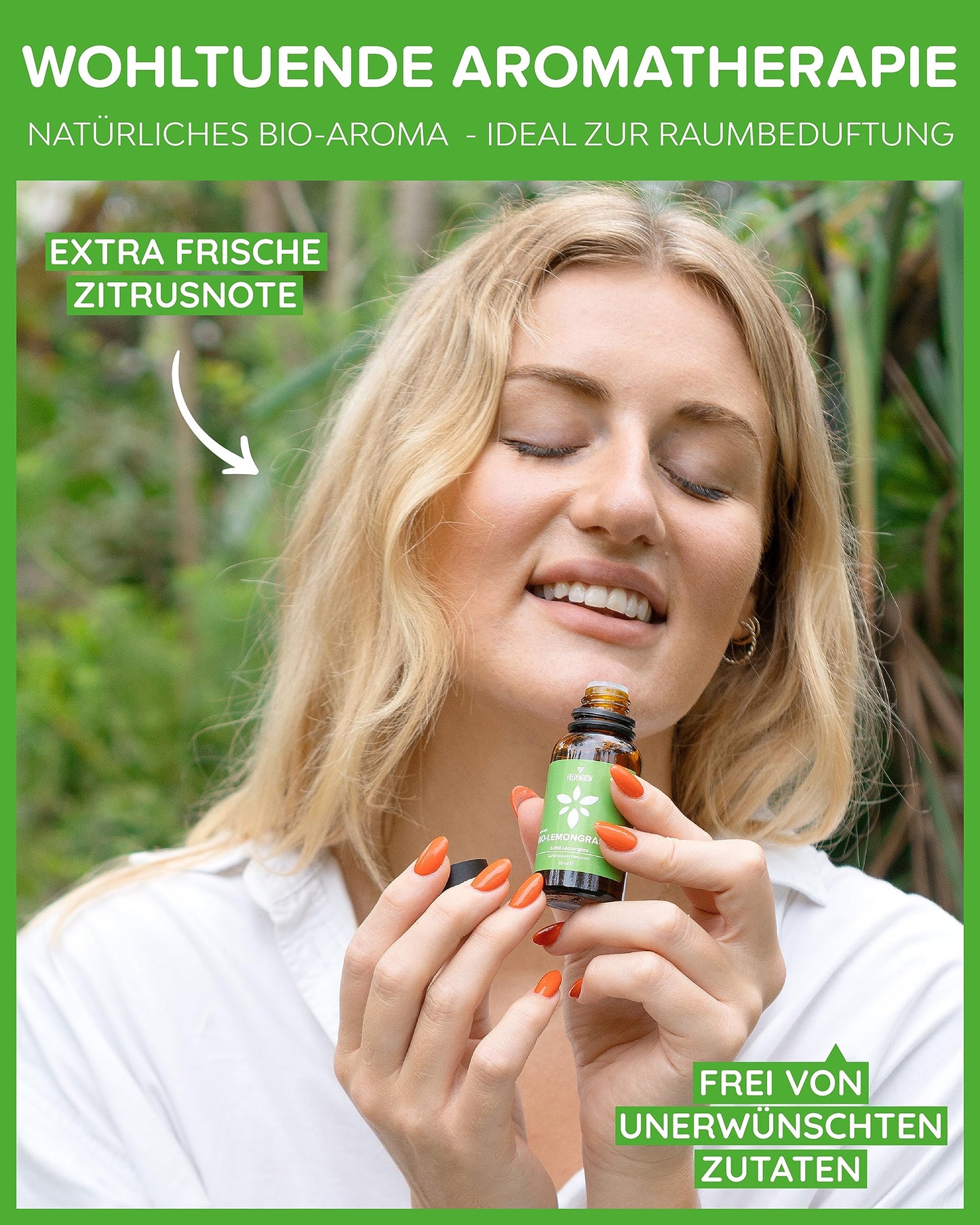 A woman holding a bottle of Heldengrun Organic Essential Oil 30ml lemongras