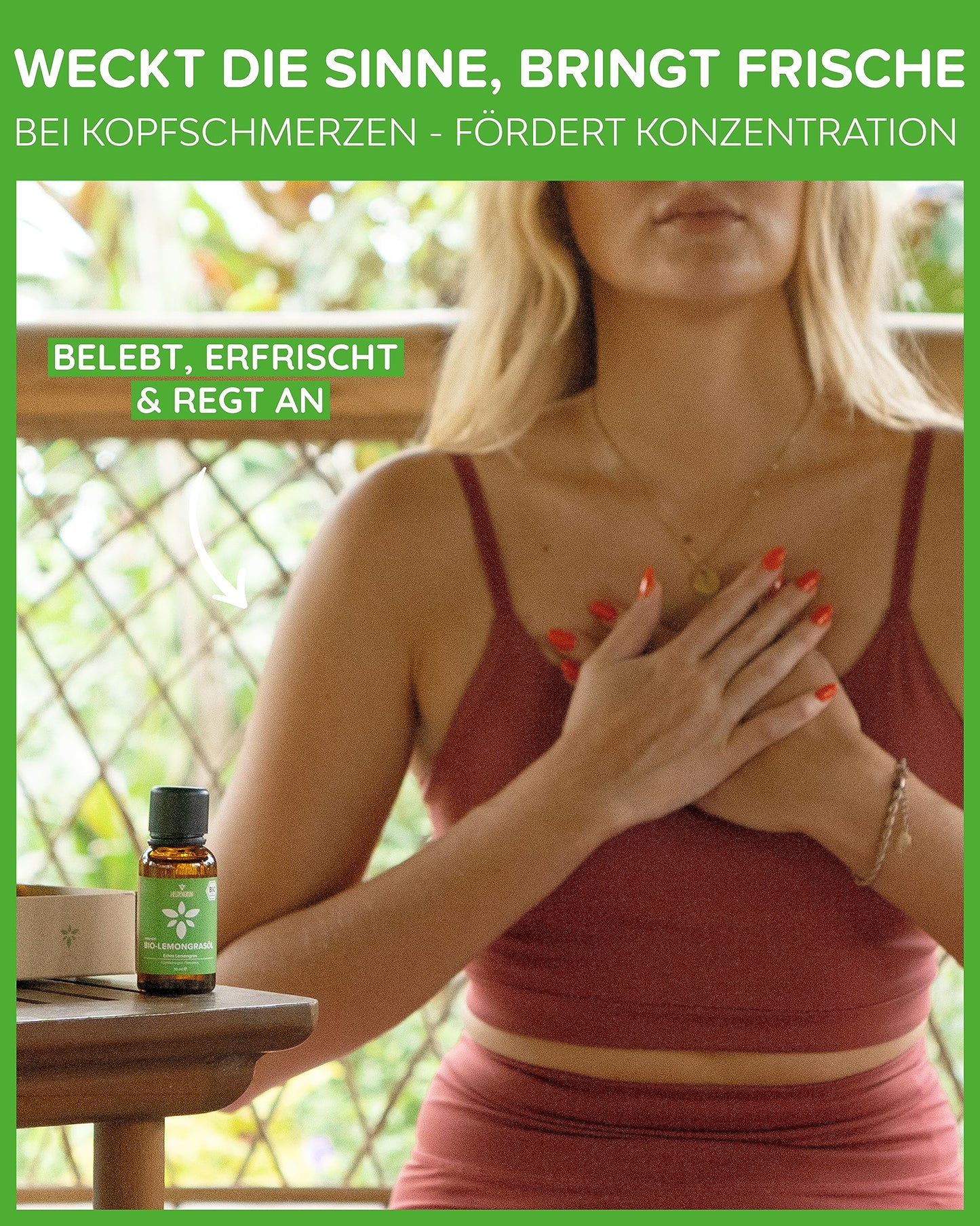A woman and a bottle of Heldengrun Organic Essential Oil 30ml lemongras