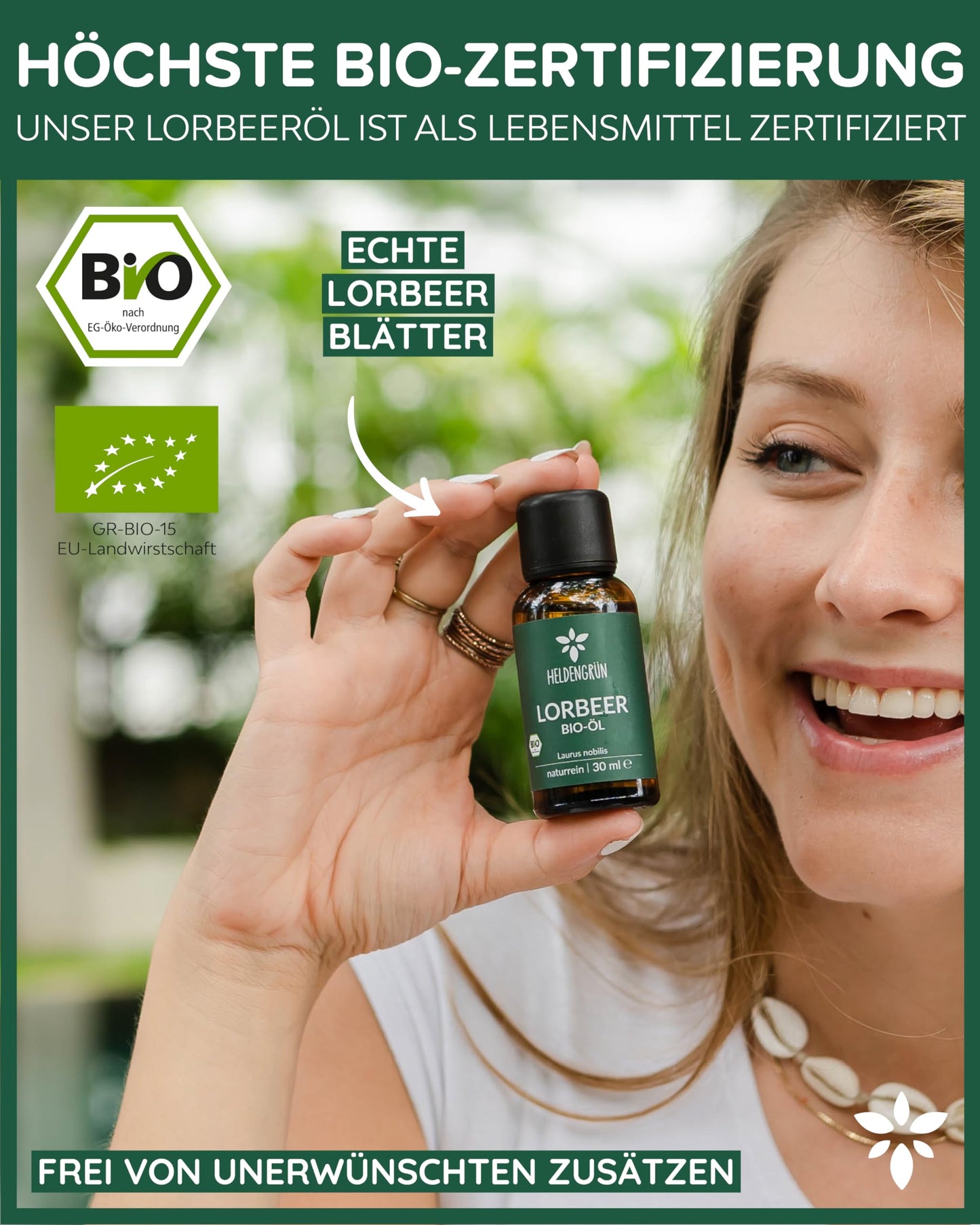 A woman holding a bottle of Heldengrun Organic Essential Oil 30ml lorbeer