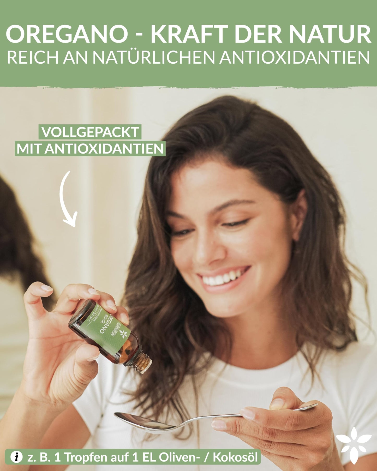 A woman holding a bottle of Heldengrun Organic Essential Oil 30ml oregano