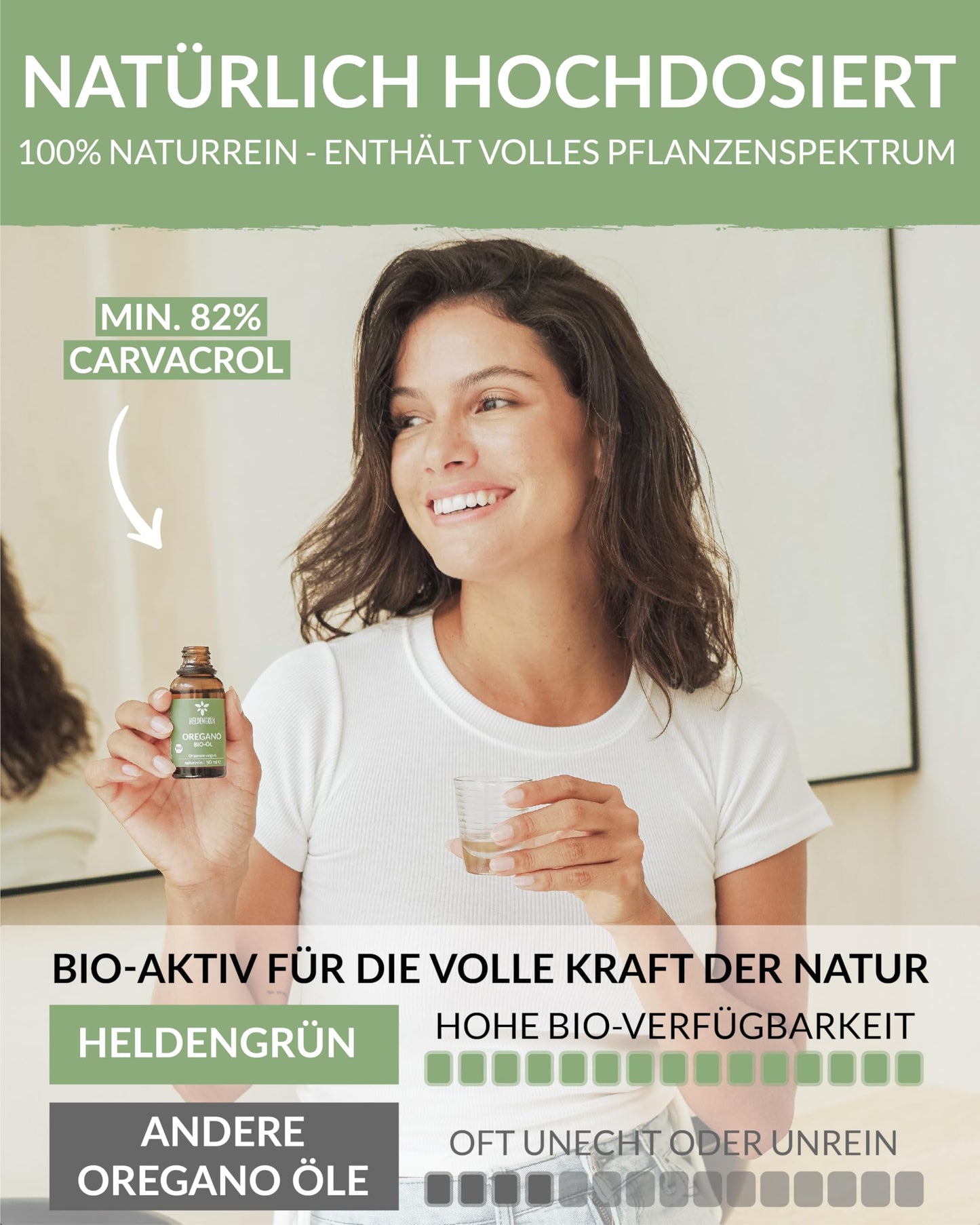 A woman holding a bottle of Heldengrun Organic Essential Oil 30ml oregano