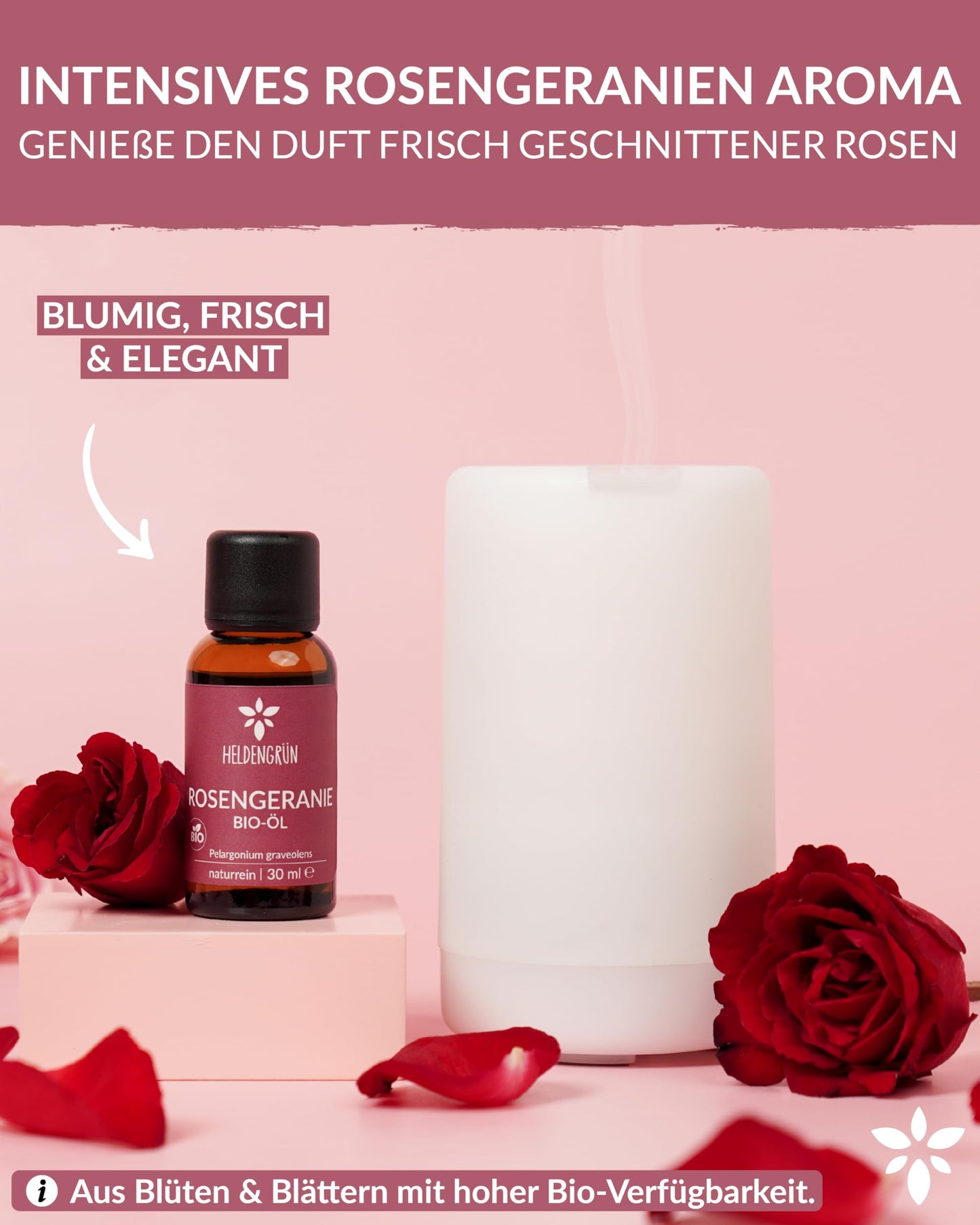 A candle with a bottle of Heldengrun Organic Essential Oil 30ml rosengeranie