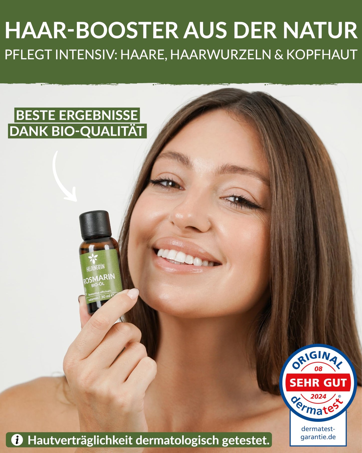 A woman holding a bottle of Heldengrun Organic Essential Oil 30ml rosmarin
