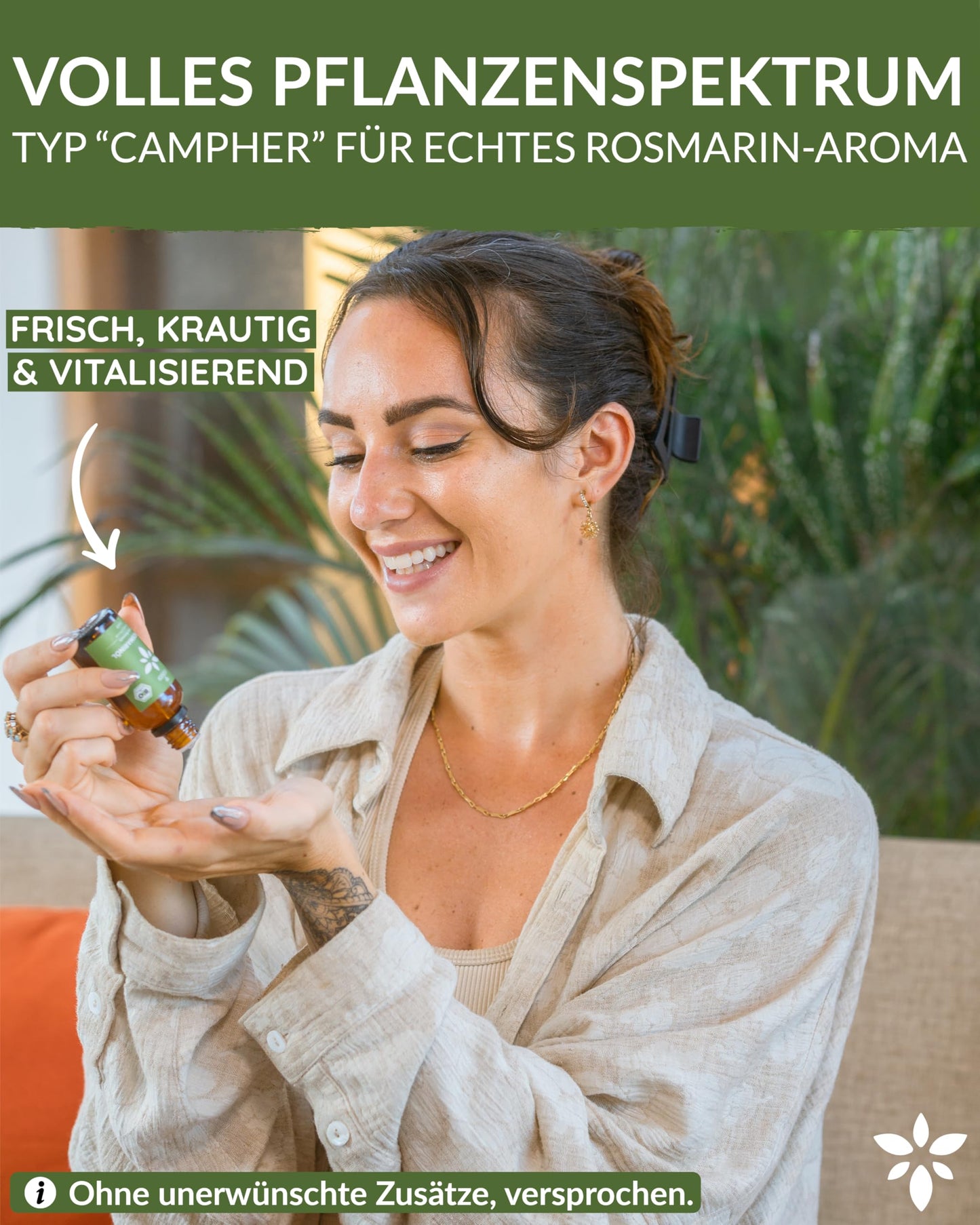 A woman holding a bottle of Heldengrun Organic Essential Oil 30ml rosmarin