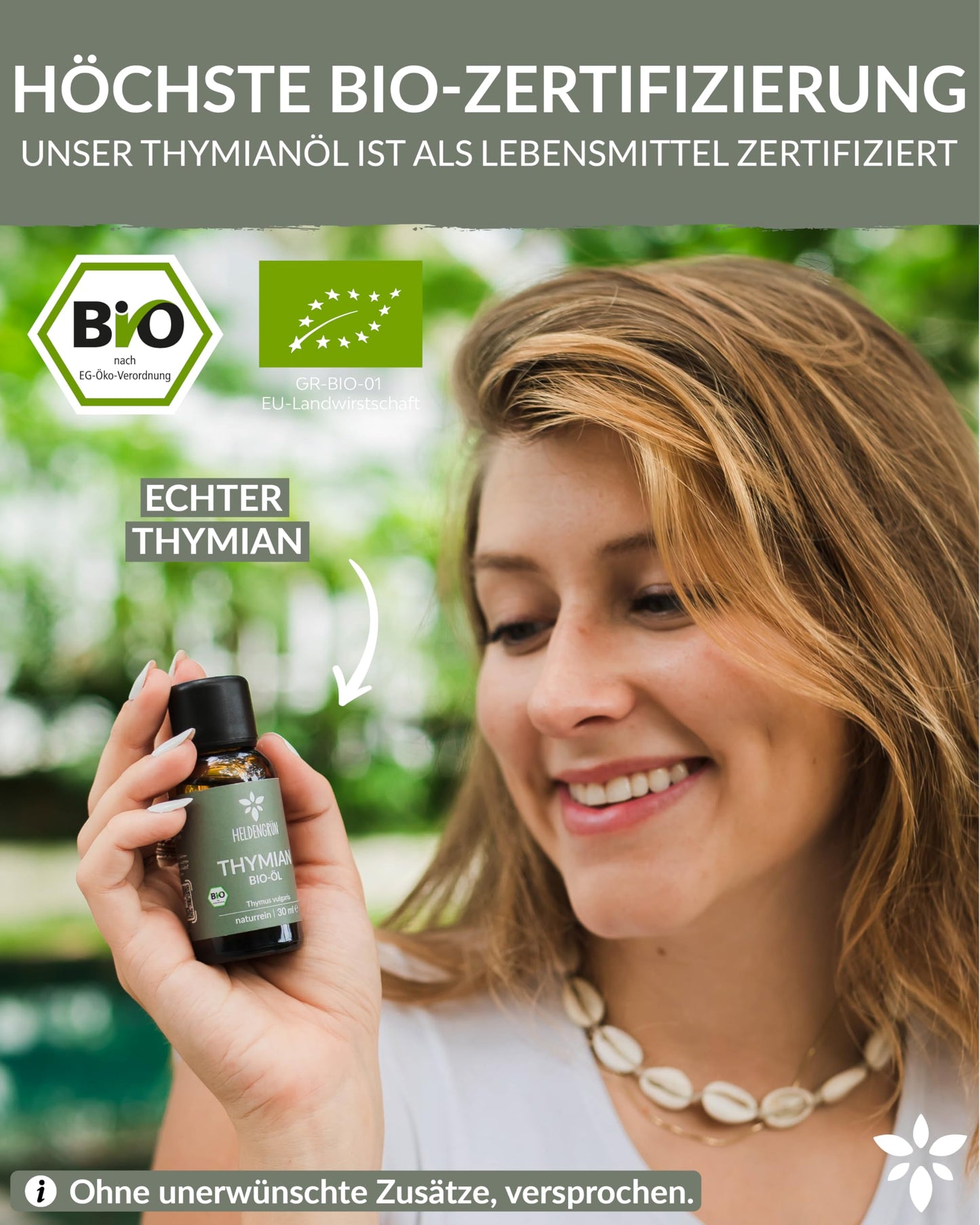 A woman holding a bottle of Heldengrun Organic Essential Oil 30ml thymian