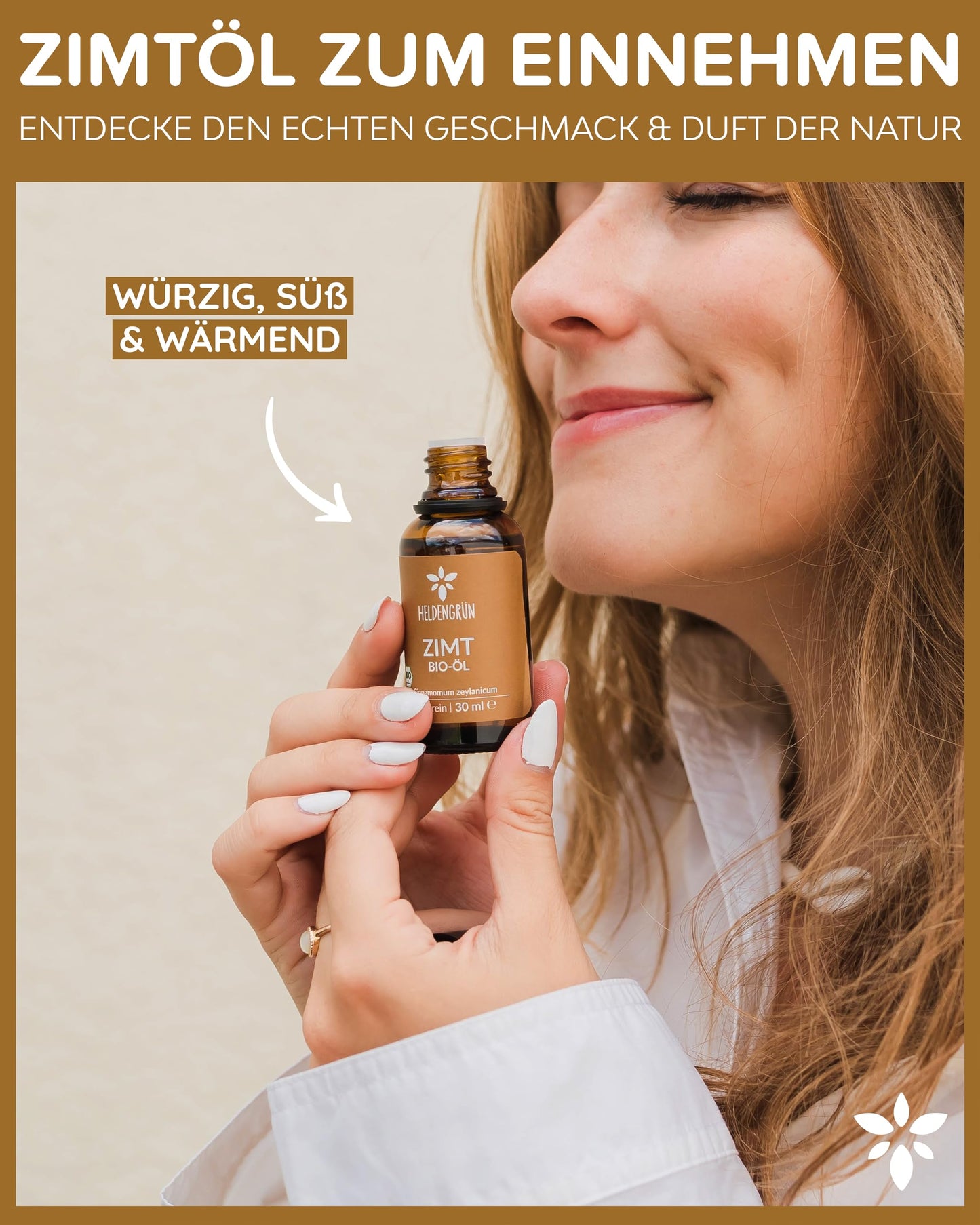 A woman holding a bottle of Heldengrun Organic Essential Oil 30ml zimt