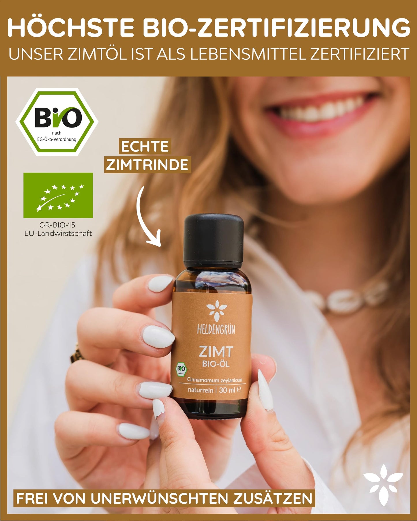 A woman holding a bottle of Heldengrun Organic Essential Oil 30ml zimt
