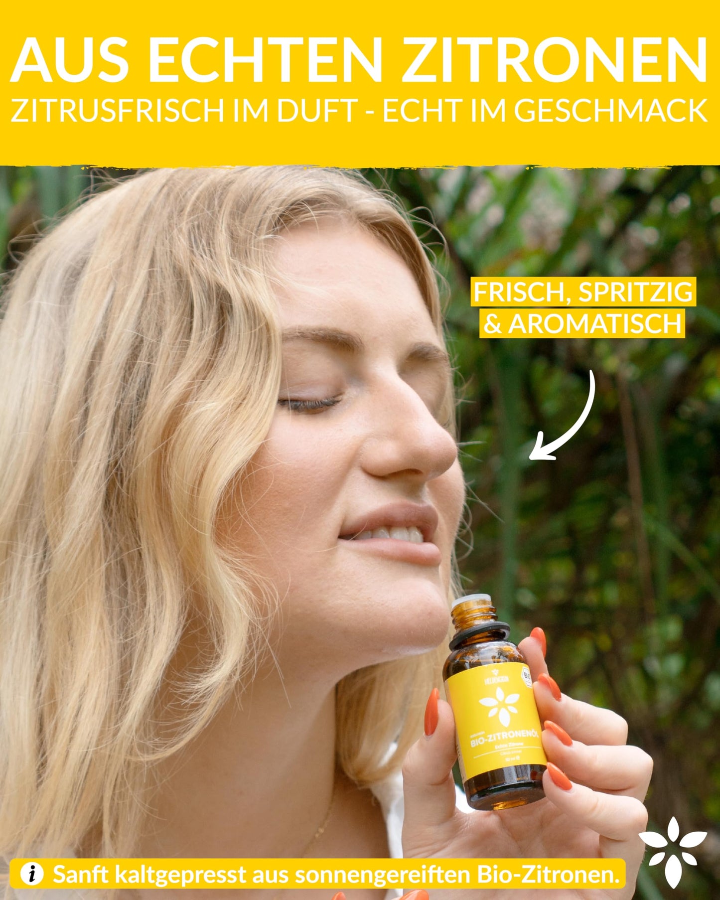 A woman holding a bottle of Heldengrun Organic Essential Oil 30ml zitrone