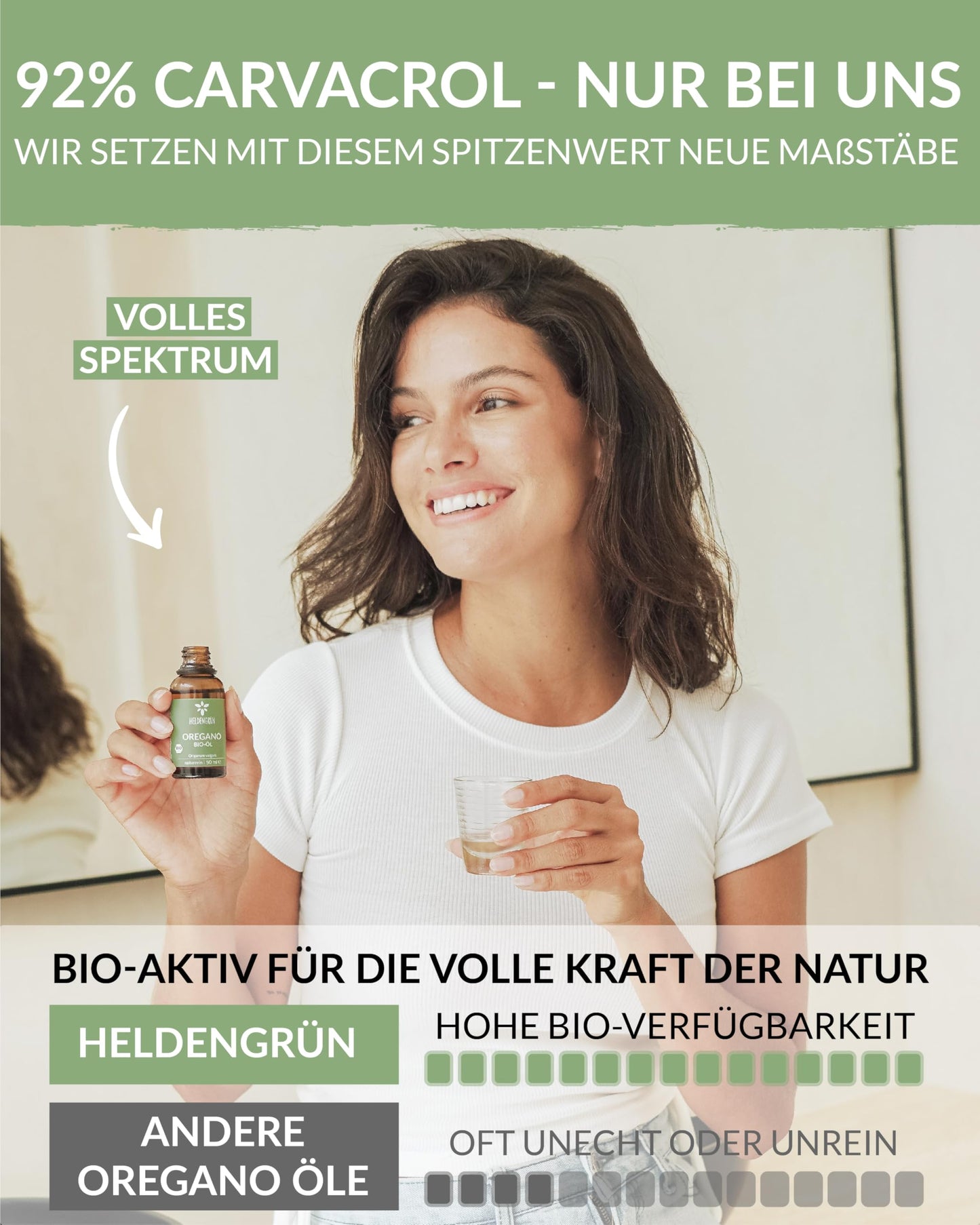 A woman holding a bottle of Heldengrun Organic Essential Oil 30ml