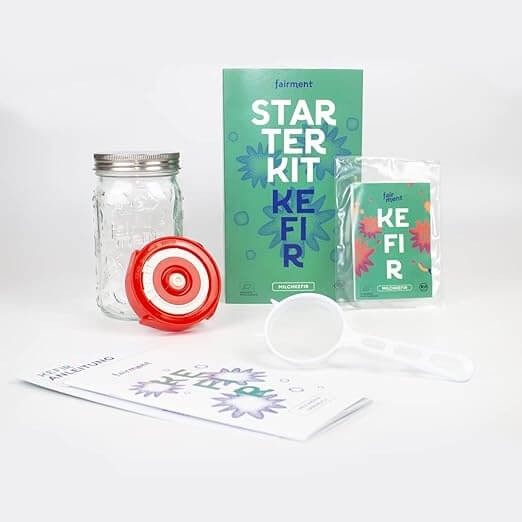 Milk kefir starter kit with jar, strainer, and grains ideal for beginners who love self-sufficiency.