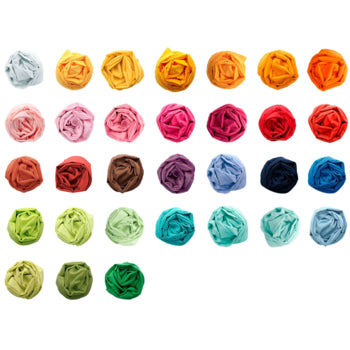 A rainbow of rolled organic cotton cloths neatly displayed in rows—perfect for imaginative play, crafts, or eco-friendly gift wrap