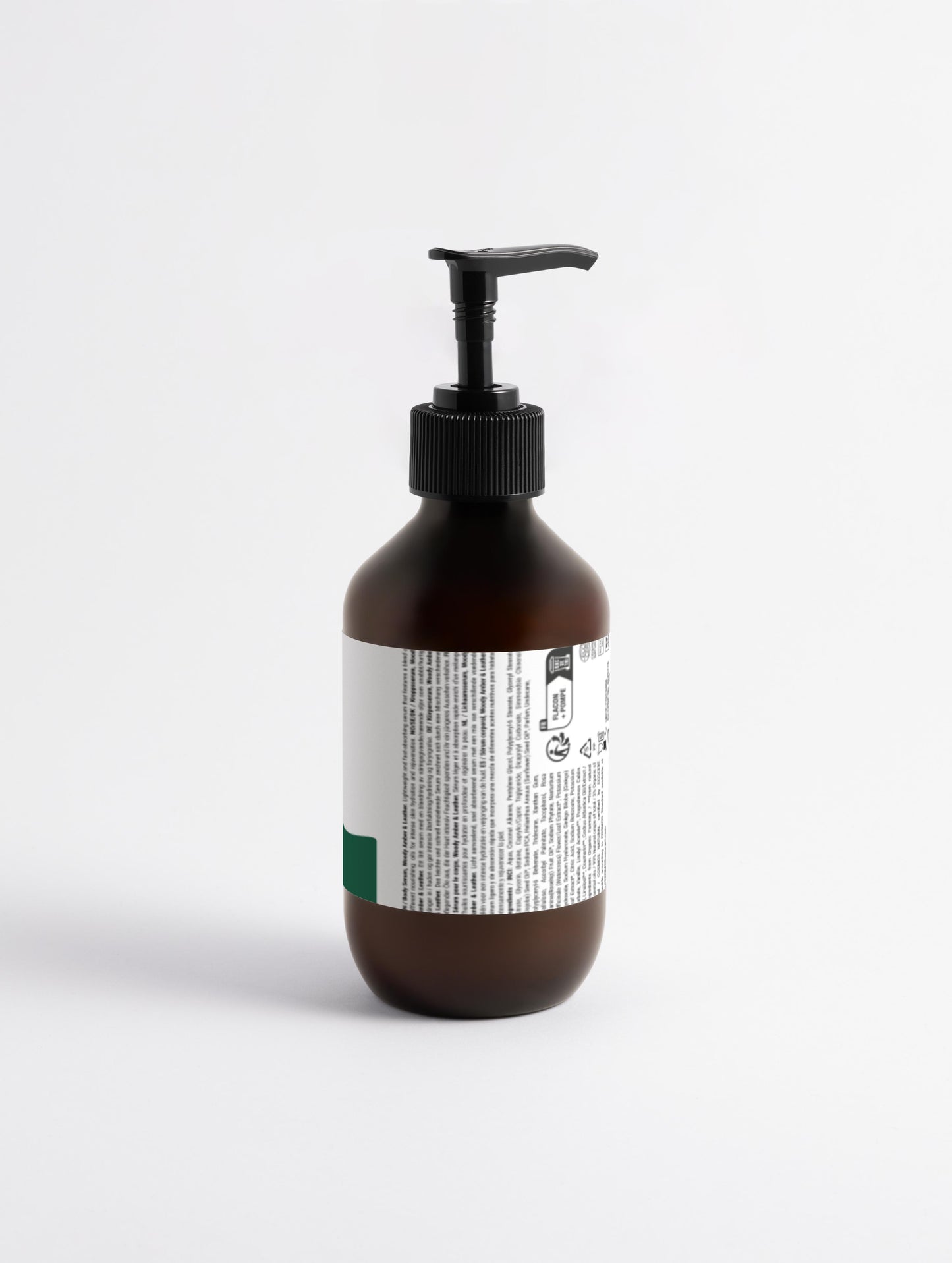 Silk Skin Body Serum, Woody Amber & Leather back with white label on a brown pump with green cloud nine logo natural ingredients vegan