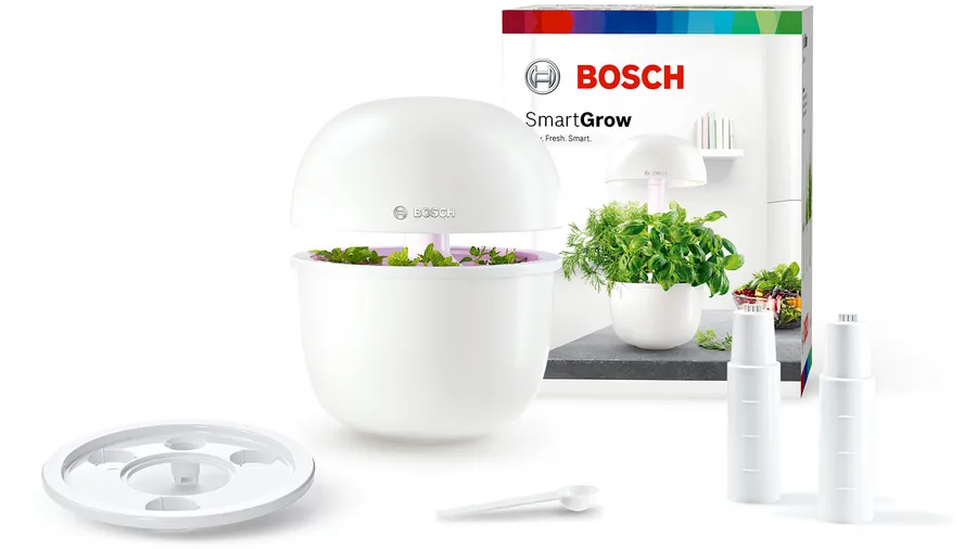 Bosch SmartGrow3 indoor garden kit with LED grow light, nutrients, accessories, and product packaging.