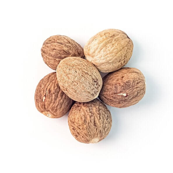 Close up of organic nutmeg from Sonnentor, finely processed. On a white background