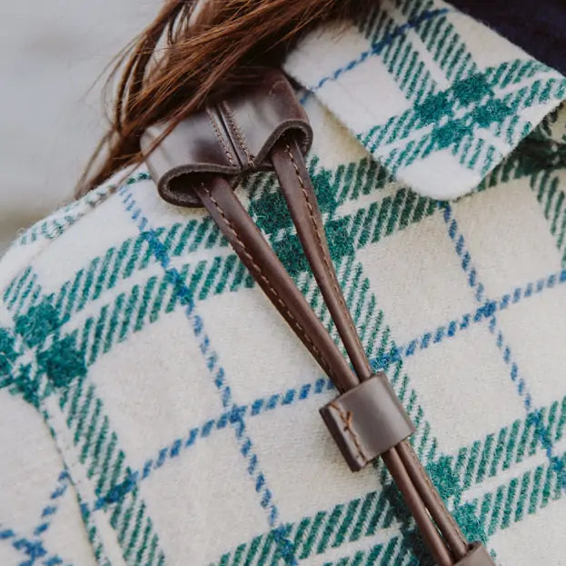 Close-up of Turquoise canvas and leather handbag