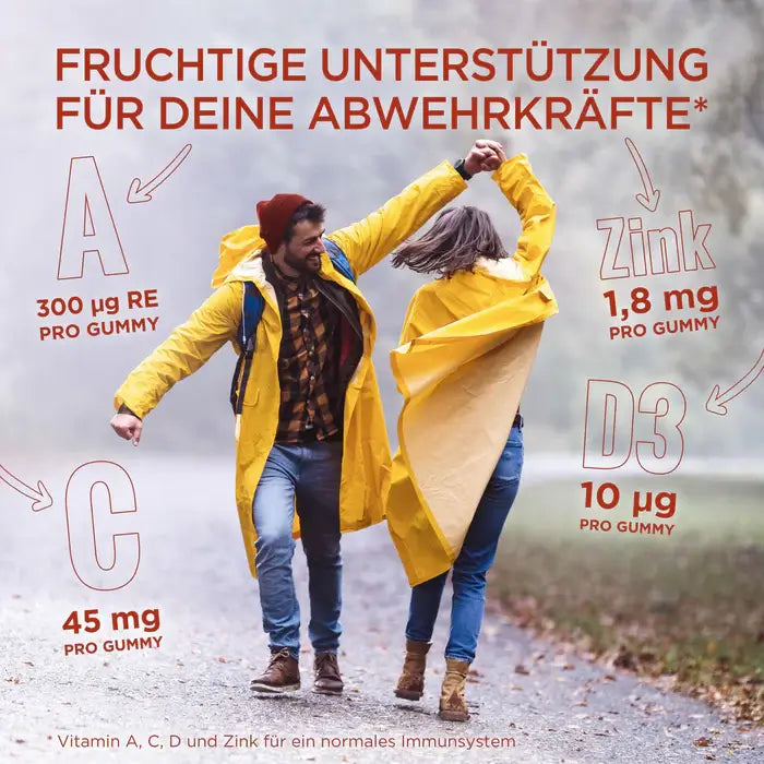 Happy couple dancing in the rain, showing benefits of vitamin A, C, D3 and Zinc per gummy for immune support.