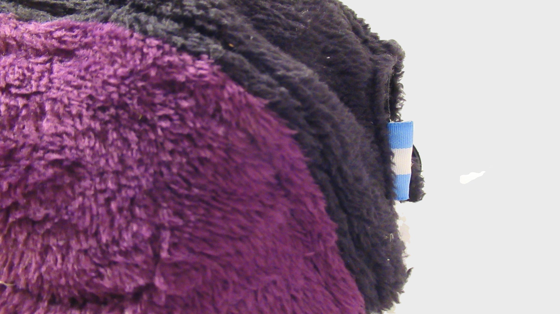 Zig Zag upcycled black purple cap. made from repurposed textiles, combining sustainability, durability, and style for an eco-friendly fashion choice