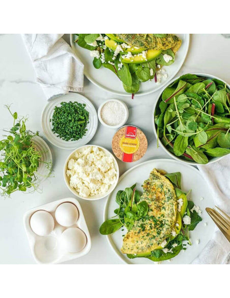 Fluffy omelette with greens, feta, and herbs, perfectly seasoned with Rührei Gewürz spice blend fresh and full of flavor