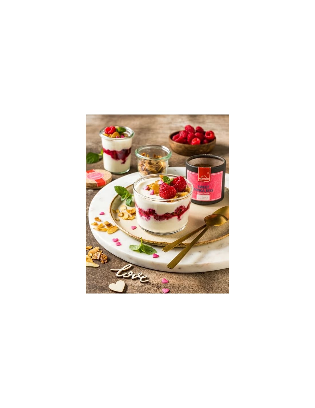 Creamy parfaits topped with fresh raspberries and mint, paired with Sweet Tonka Kiss spice for a dreamy dessert moment.
