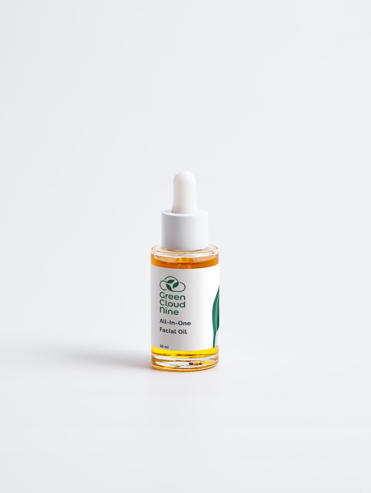 All-In-One Facial Oil 30 ml in a glass dropper bottle with Green Cloud Nine Logo