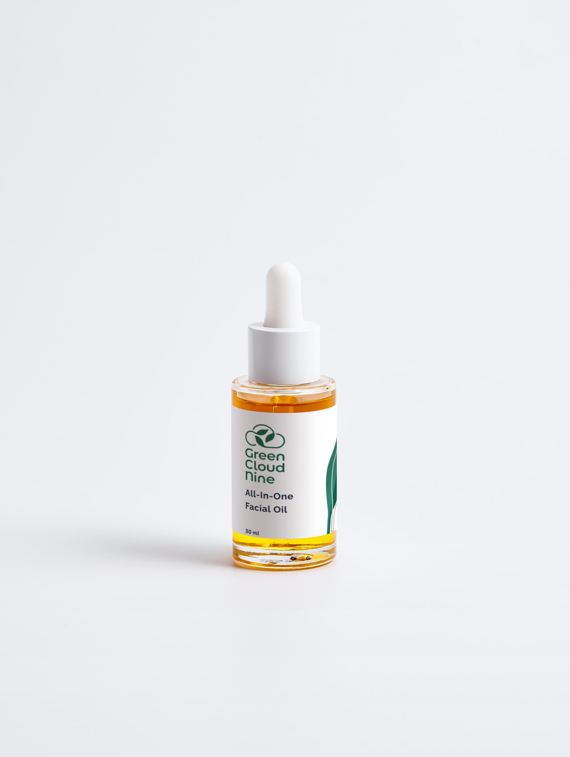 All-In-One Facial Oil 30 ml in a glass dropper bottle with Green Cloud Nine Logo