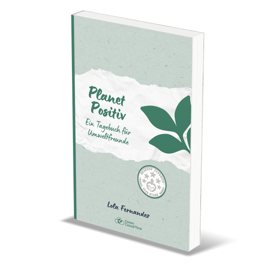 Book titled 'Planet Positiv' with green leaf design on a white background