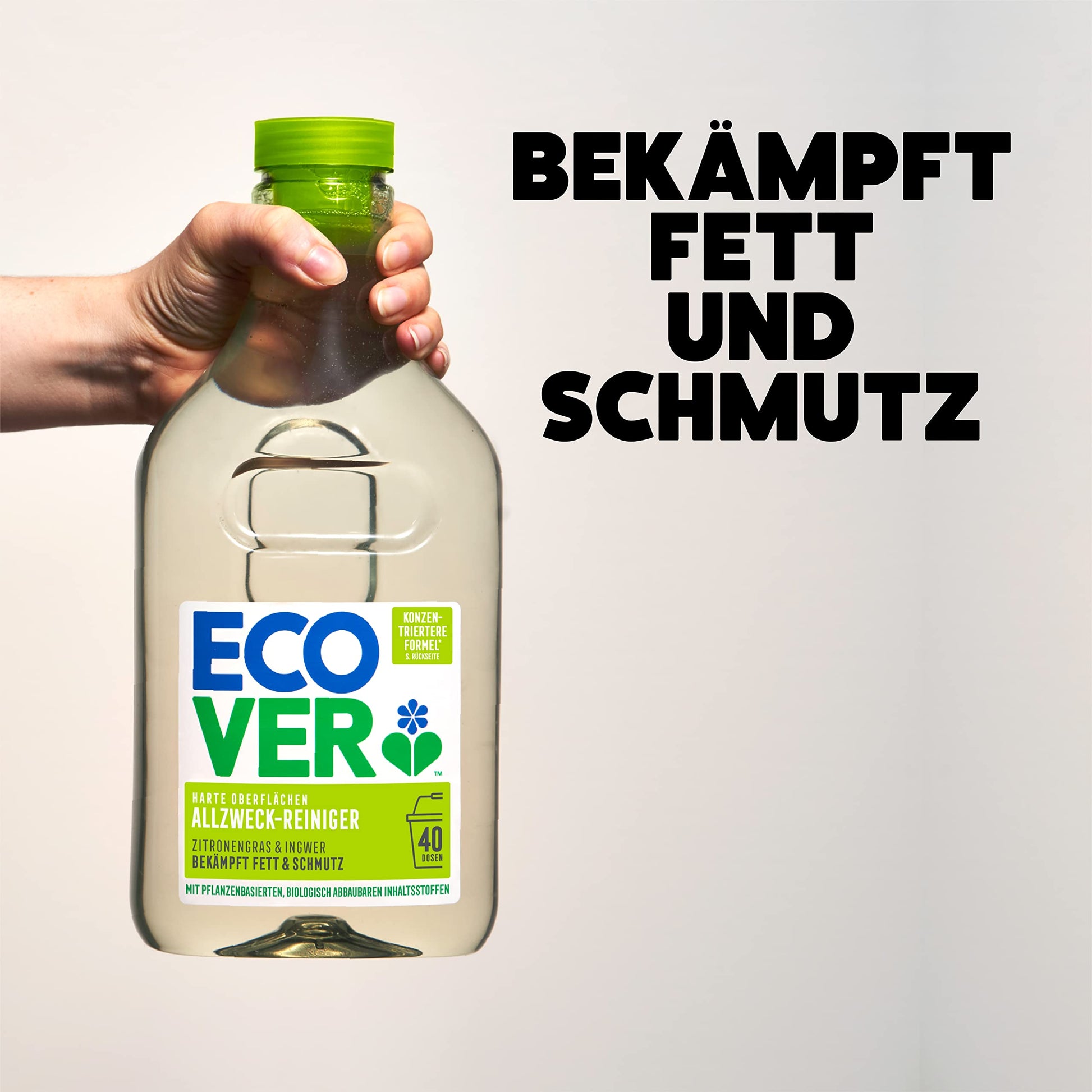 A hand holding Ecover All Purpose Cleaner 100% recycled plastic bottle