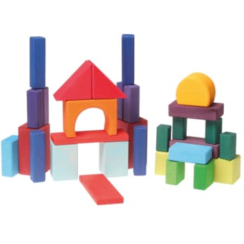 Colorful Grimm’s wooden blocks arranged into creative structures