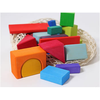 Colorful Grimm’s wooden blocks in various shapes with bag