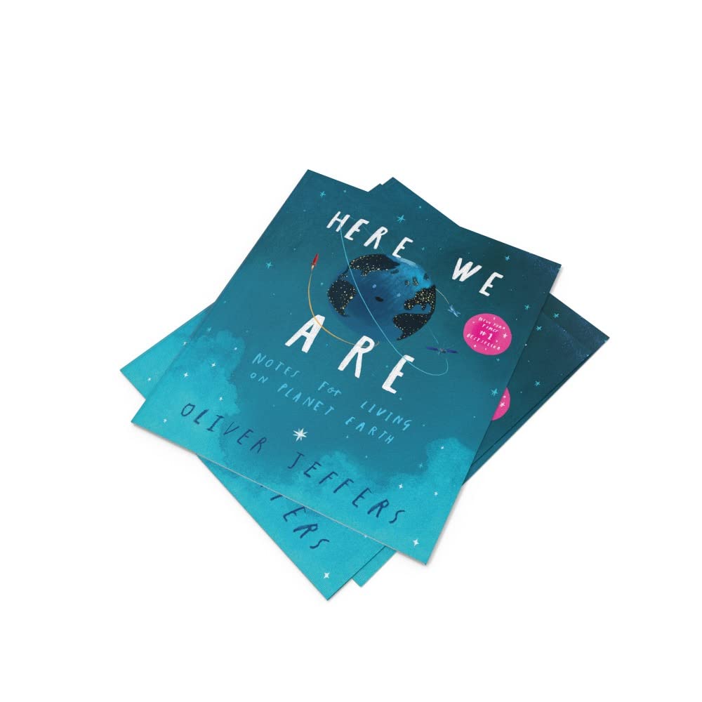 Stack of books titled 'Here We Are' by Oliver Jeffers on a white background