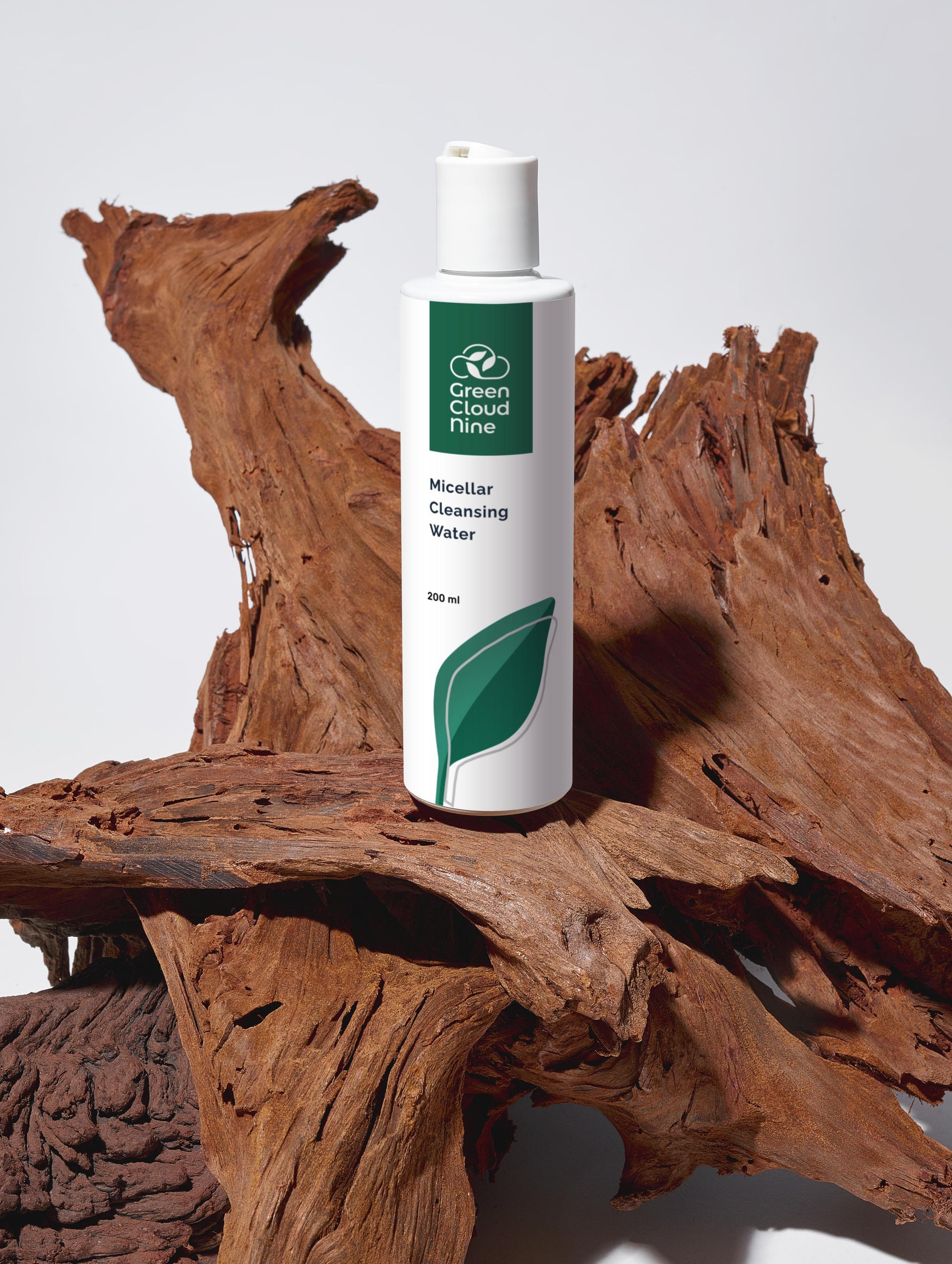 Green Cloud Nine Micellar Cleansing Water on drifted wood