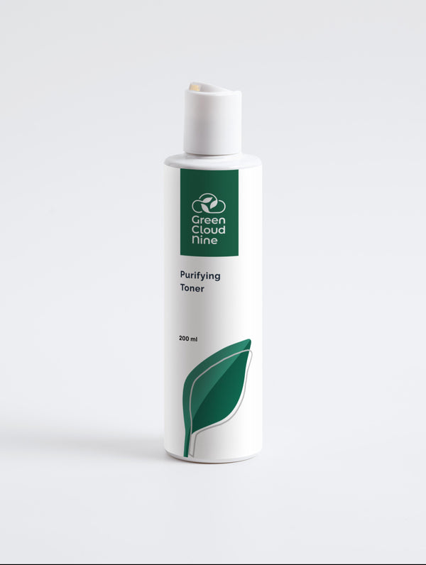 A Purifying Toner labelled on a white bottle, featuring Green Cloud Nine logo and a large green leaf design. The bottle contains 200 ml of product and is shown against a plain white background. (front view)