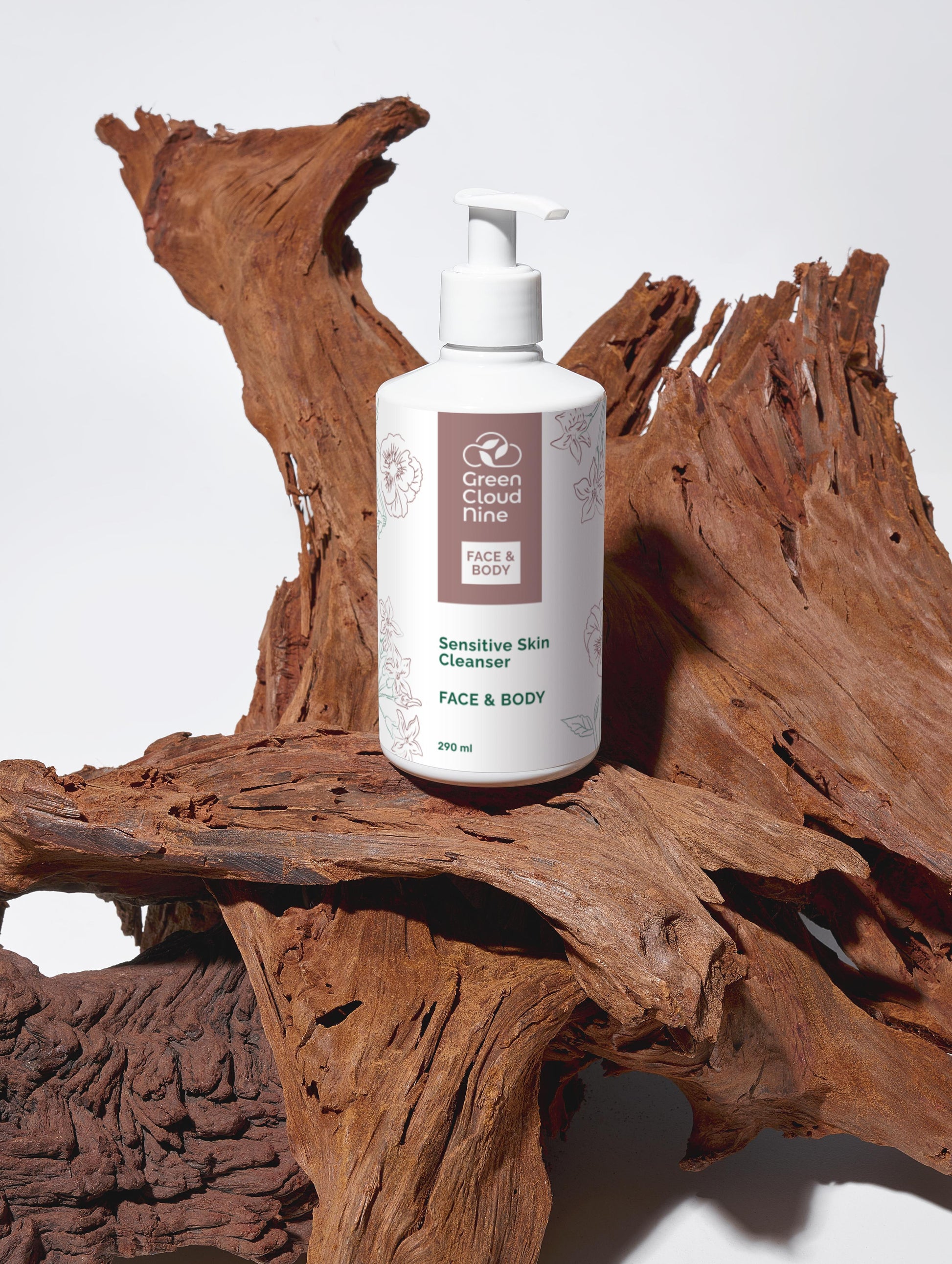 White bottle of Green Cloud Farm sensitive skin cleanser on a wooden surface