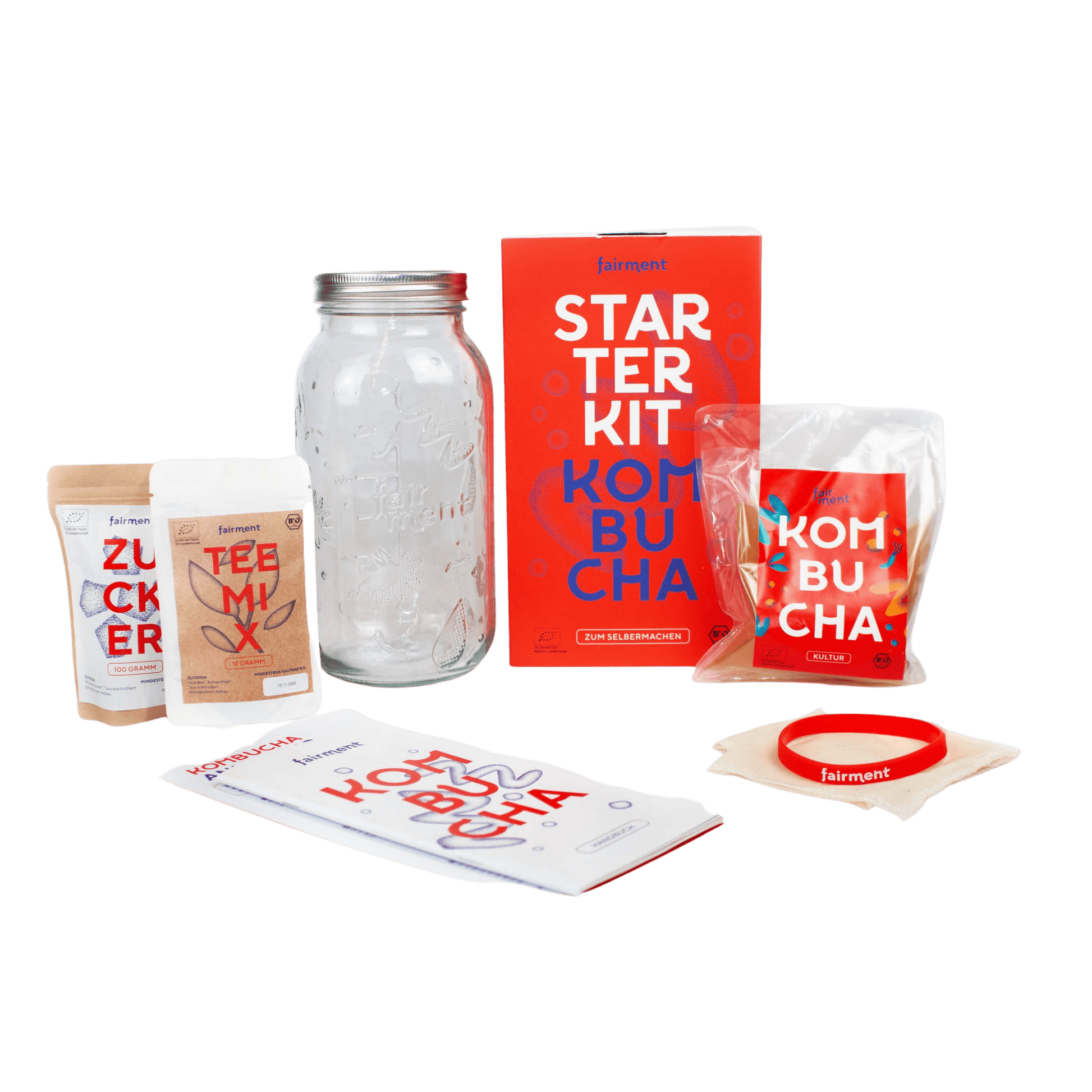 Fairment Kombucha Starter Kit with tea mix, sugar, jar, SCOBY, cloth, instructions, and bright red packaging.