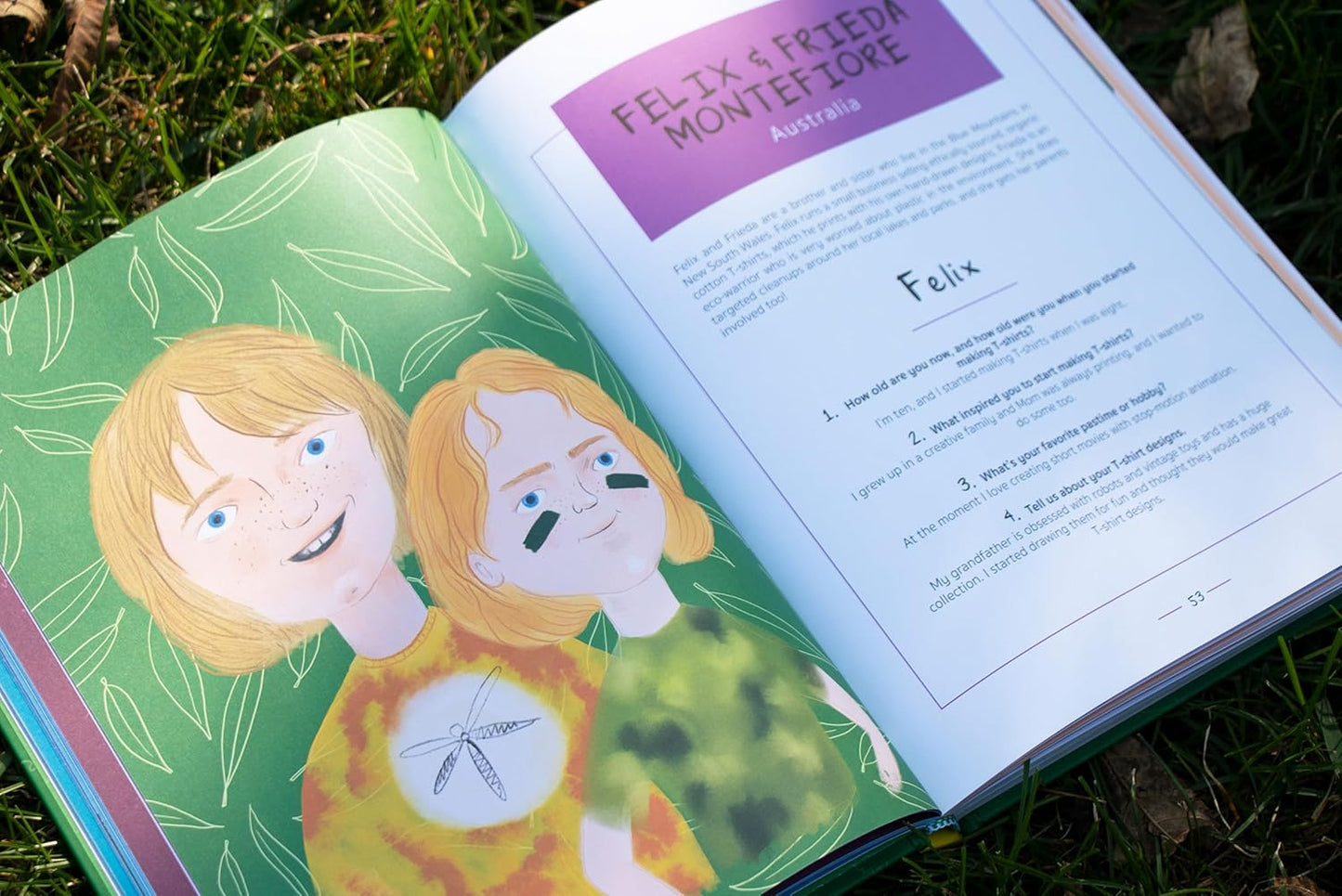 Open book with illustrations of two characters and text on a grassy background