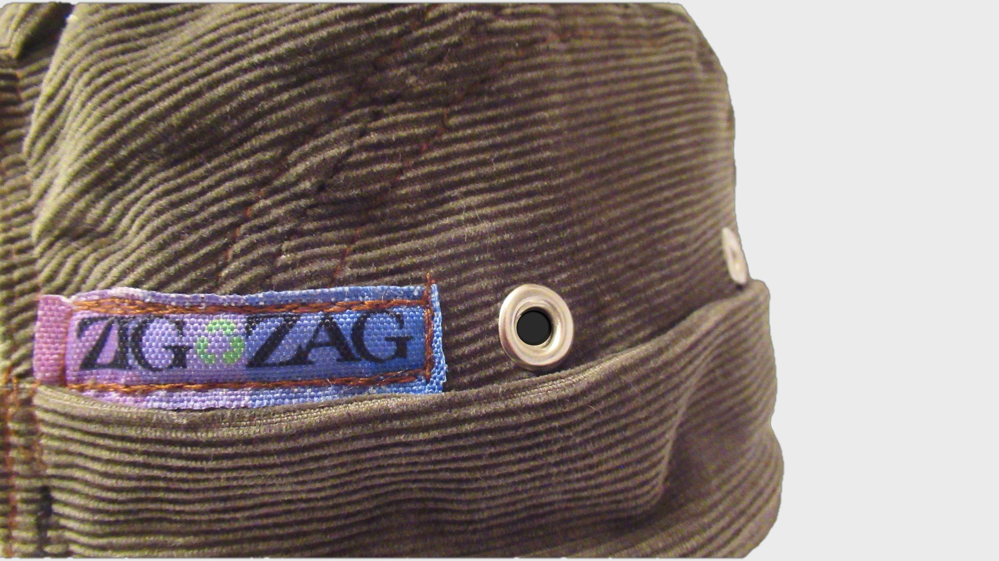 Zig Zag upcycled corduroy green army hat. made from repurposed textiles, combining sustainability, durability, and style for an eco-friendly fashion choice