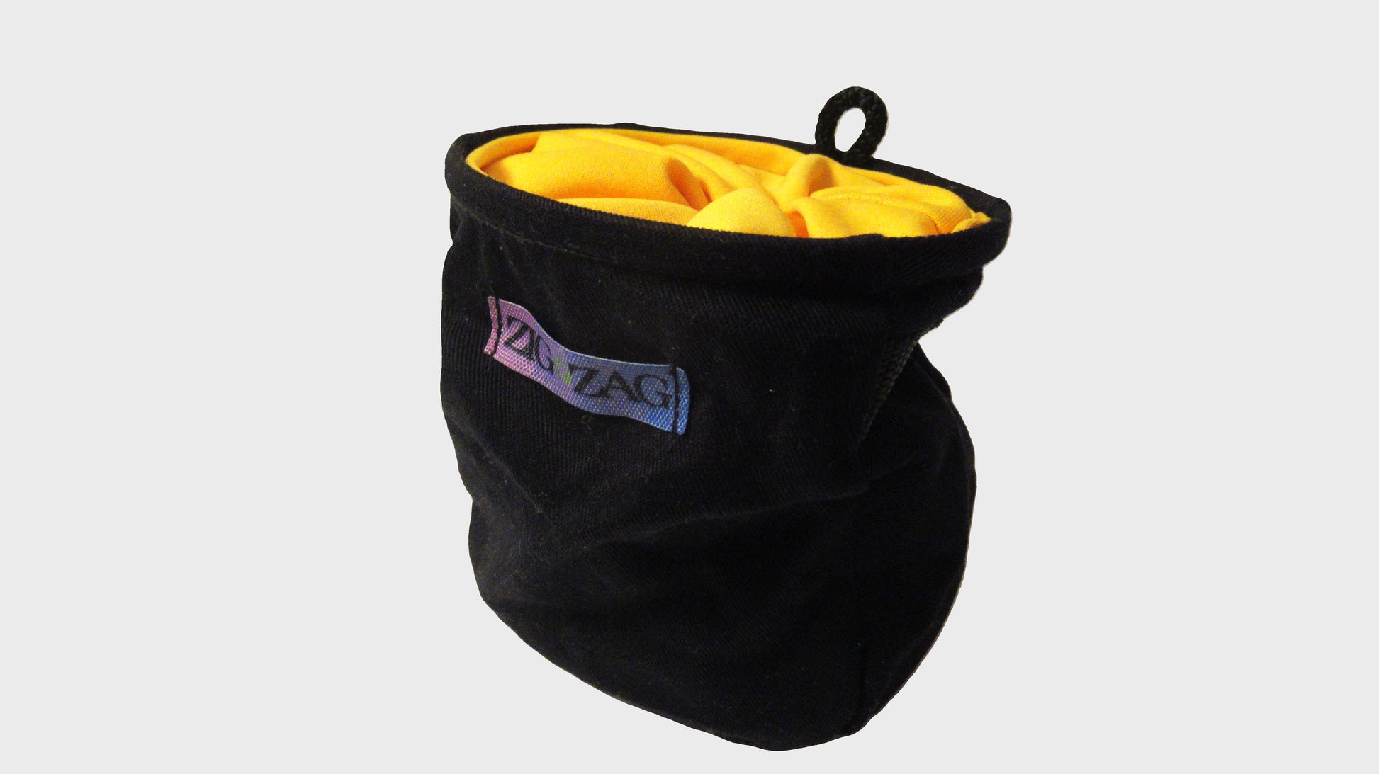 Zig Zag upcycled yellow and black chalk bag. made from repurposed textiles, combining sustainability, durability, and style for an eco-friendly fashion choice