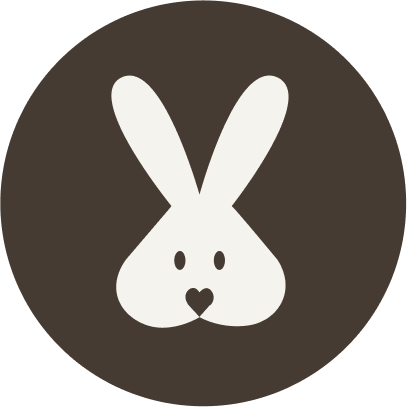 White rabbit face on a black background. For KIND Rituals