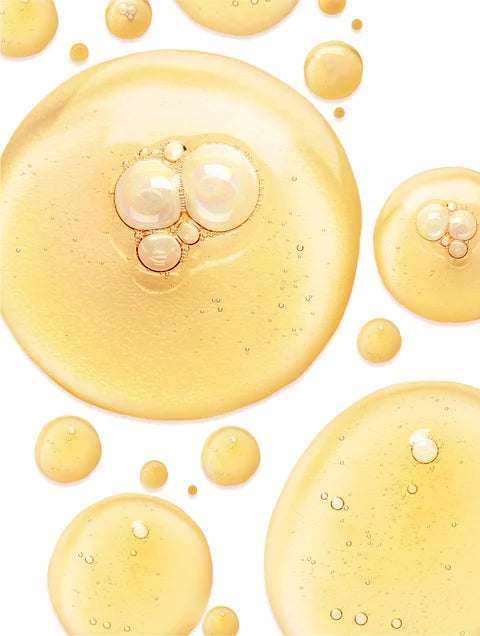 Gold bubbles on a white background. For KIND Rituals