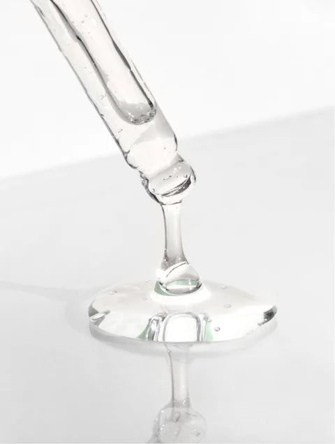 Close-up of a clear glass wine glass on a white background. For KIND Rituals